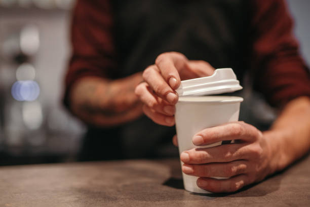 istock Barista serving takeaway coffee at counter 1308520886