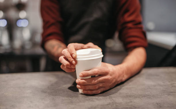 istock Bartender serving takeaway coffee in coffee shop 1308520890