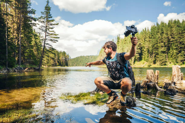 istock Young explorer photographing nature and vlogging. 1308520938