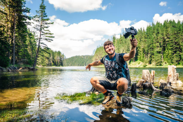 istock Young explorer photographing nature and vlogging. 1308521036