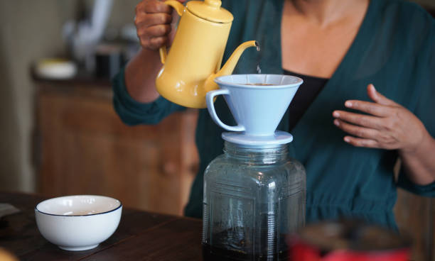 istock barista preparing brewing coffee with coffee maker and drip kettle. 1308521103