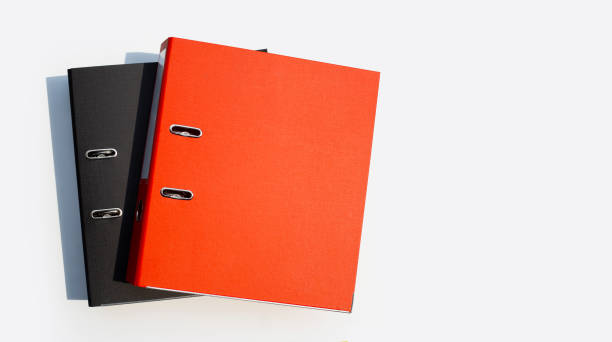 istock Red and black office folders on white background. 1308521211