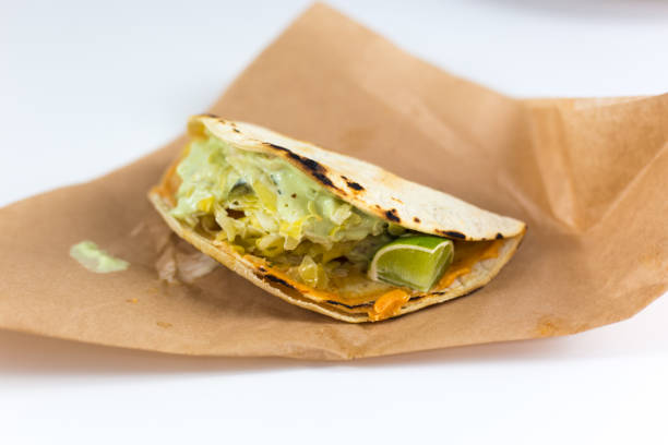 istock Mexican Cuisine: Fish Taco on Brown Paper 1308523254