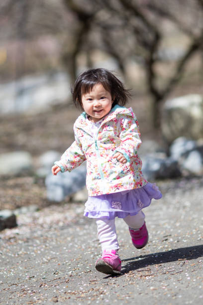 istock Little girl having fun running along a path 1308527359