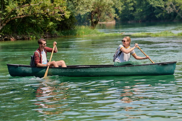 istock friends are canoeing in a wild river 1308532546