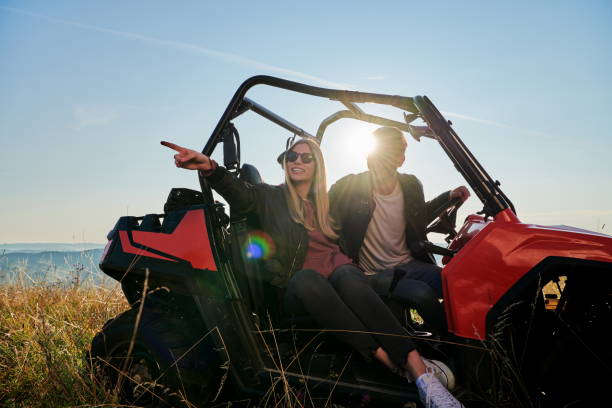 istock couple enjoying beautiful sunny day while driving a off road buggy 1308533155