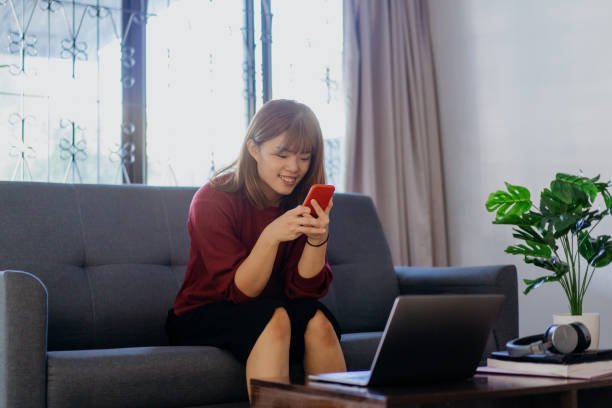 istock An Asian Chinese woman using smartphone at home 1308533394