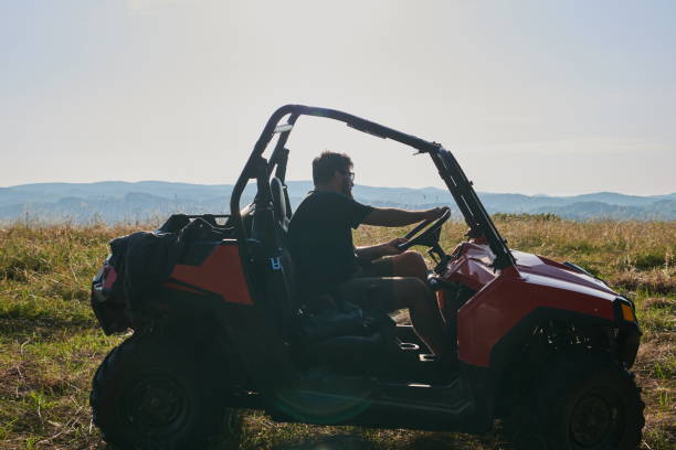 istock man enjoying beautiful sunny day while driving a off road buggy car 1308535068