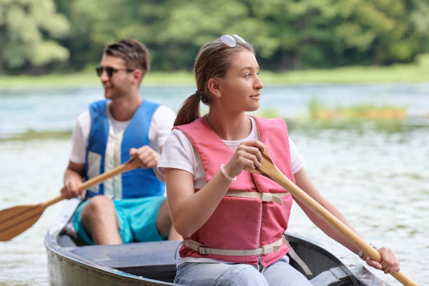 istock friends are canoeing in a wild river 1308536180