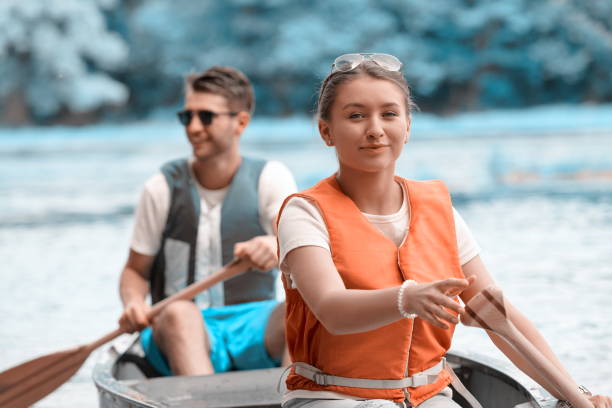 istock friends are canoeing in a wild river 1308537001