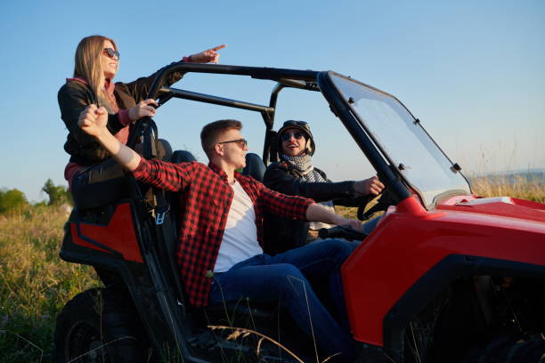 istock group young happy people enjoying beautiful sunny day while driving a off road buggy car 1308538758