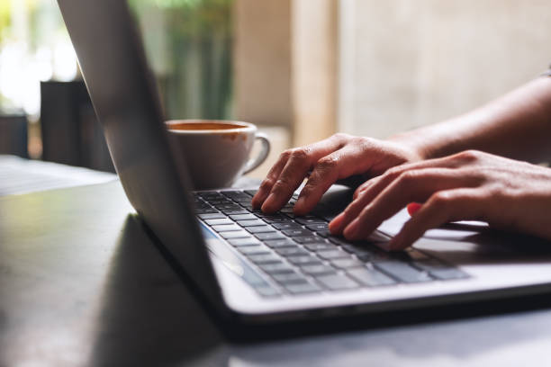 istock a woman working and typing on laptop computer keyboard on the table 1308540693