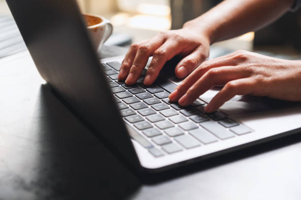 istock a woman working and typing on laptop computer keyboard on the table 1308540774