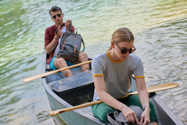 istock friends are canoeing in a wild river 1308540896