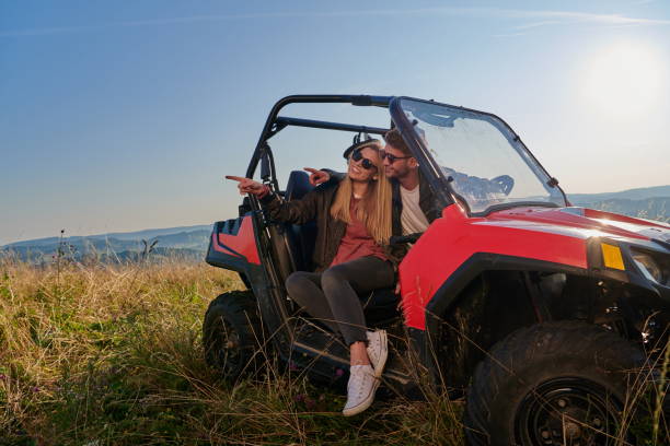 istock couple enjoying beautiful sunny day while driving a off road buggy 1308542768