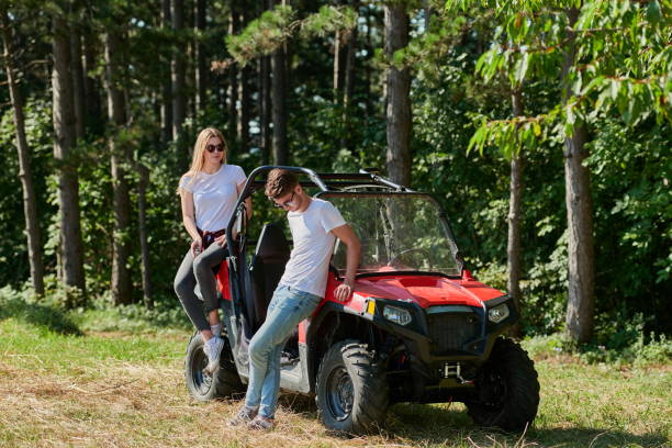 istock couple enjoying beautiful sunny day while driving a off road buggy 1308543735