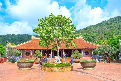 Wat Uposatharam Temple at noon under blue sky,Located along the banks of the Sakae Krang River in Uthai Thani, Thailand.