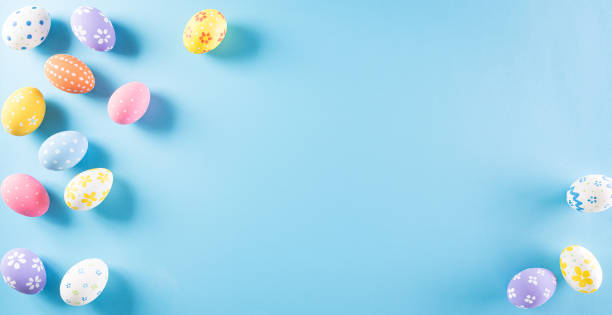 istock Happy easter! Colourful of Easter eggs on pastel blue background. Greetings and presents for Easter Day celebrate time. Flat lay ,top view. 1308550056