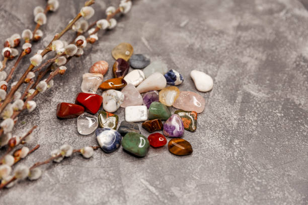istock Multiple semi precious gemstones on board. Gemstones crystal minerals 1308550262