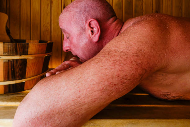 sauna. A man sweats in a sauna. swedish sauna stock pictures, royalty-free photos & images