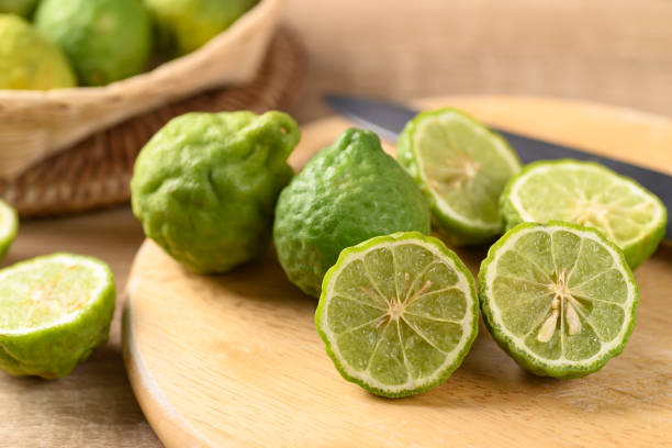 istock Fresh bergamot fruit on wooden cutting board 1308552647
