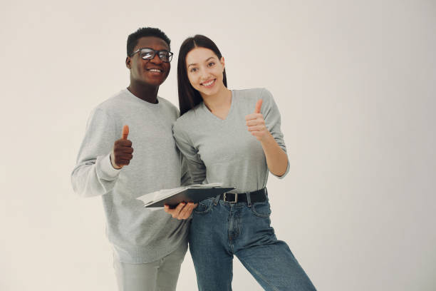 istock Young international couple working together and use tablet 1308556533