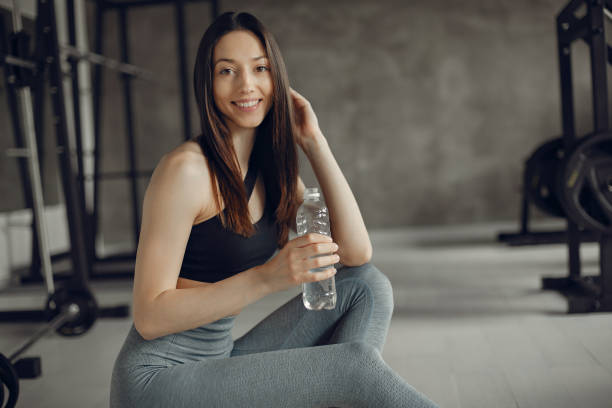 istock A beautiful girl is engaged in a gym 1308556729