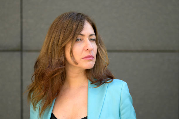 istock Pensive woman glancing sideways at the camera 1308559654