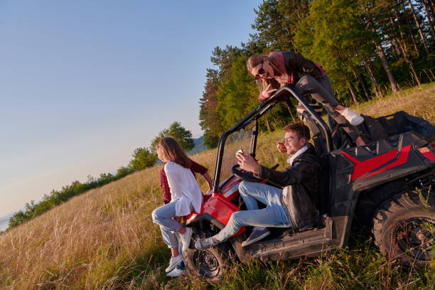 istock group young happy people enjoying beautiful sunny day while driving a off road buggy car 1308559875