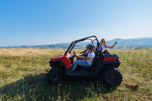 istock group young happy people enjoying beautiful sunny day while driving a off road buggy car 1308559899