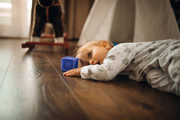 istock Baby Boy playing with building Blocks and an Basketball 1308563605