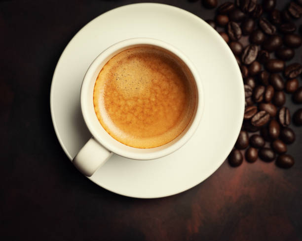 coffee espresso and roasted beans on dark background - coffee top view imagens e fotografias de stock