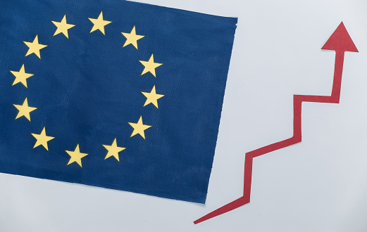 EU flag with a red growth arrow. Arrow graph going up. The economic growth