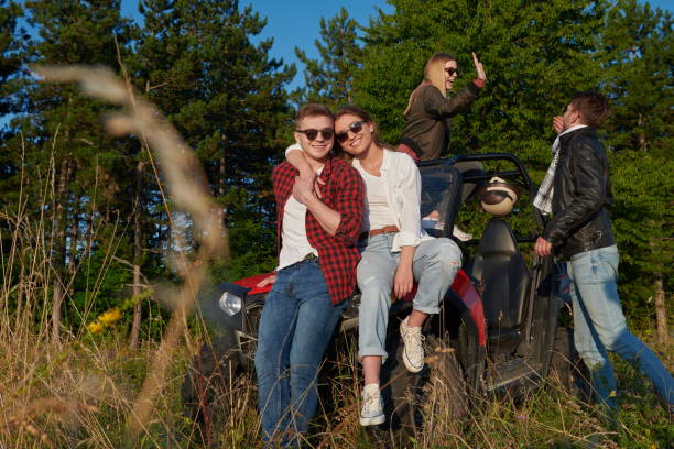 istock group young happy people enjoying beautiful sunny day while driving a off road buggy car 1308565780