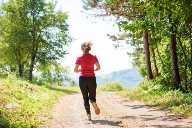 istock woman enjoying in a healthy lifestyle while jogging 1308566054