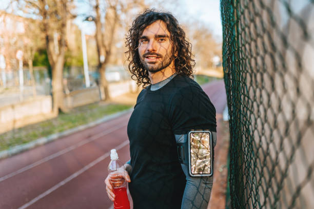 istock Leaning on fence - man sport 1308569459