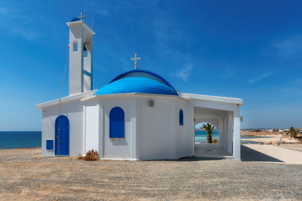 Ayia Thekla orthodox church near of Ayia Napa, Mediterranean Sea, Cyprus island Traditional white chapel with a blue roof on the Mediterranean sea coast in Cyprus island, Mediterranean Sea. cyprus agia napa stock pictures, royalty-free photos & images