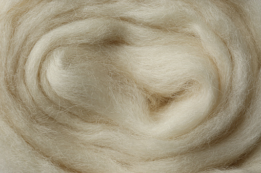 Textura de lana blanca peinado como fondo, primer plano photo
