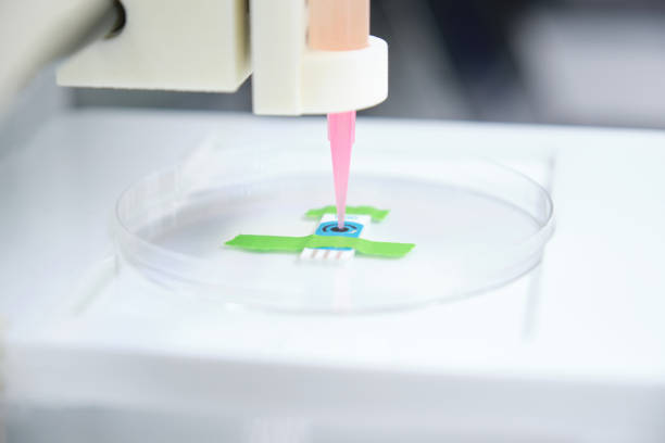 istock 3D bioprinter ready to 3D print cells onto an electrode. Biomaterials, tissue engineering concepts. 1308572864