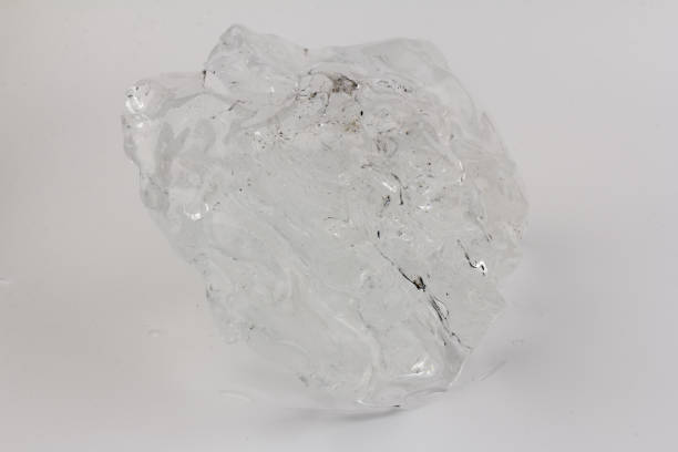istock Real beautiful ice floe on light background. Cold winter ice texture. 1308575644