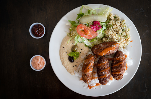 Table top view of Turkish kofta ,lamb kabab with salad.