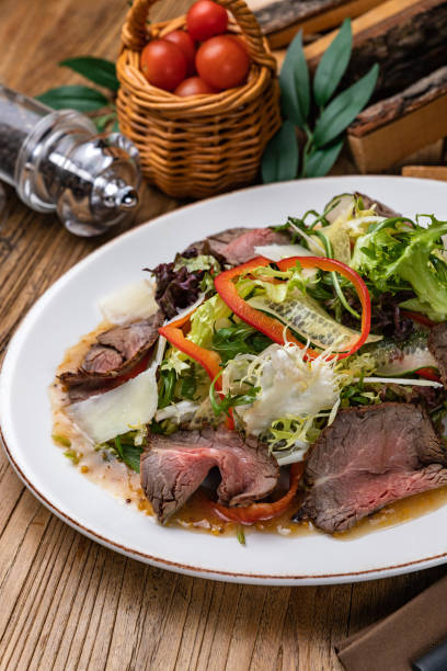 istock Salad with veal, herbs, peppers and parmesan 1308576222
