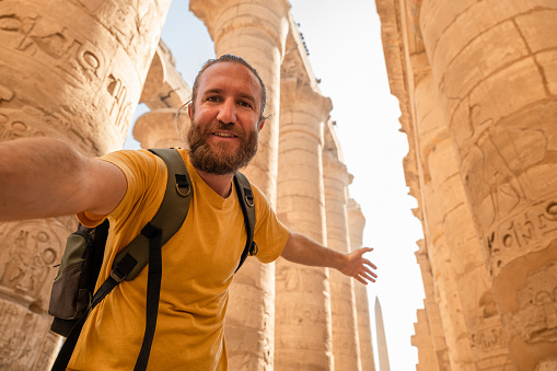 07/03/2023,Luxor,Egypt: A security guard walking in the sunlight at Karnak Temple. Karnak Temple is one of the most important tourist attractions in Egypt.