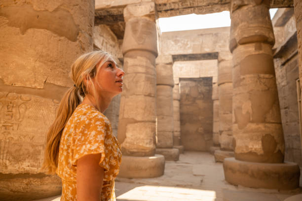 istock Woman explores ancient temples in Egypt 1308576291