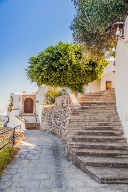 pedestrian street with stairs in Lindos, Rhodes, Greece