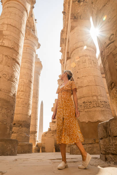 istock Woman explores ancient temples in Egypt 1308576491