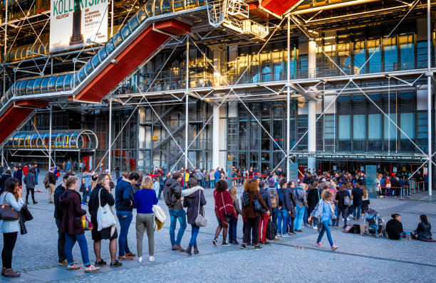 People waiting in line outside Centre Pompidou in Paris France Large group of people waiting in line outside Centre Pompidou in Paris, France pompidou center stock pictures, royalty-free photos & images