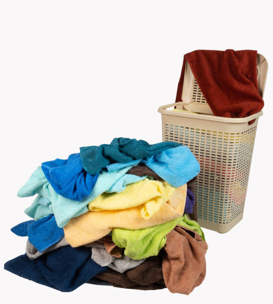 istock pile of colored towels and a Laundry basket 1308577308