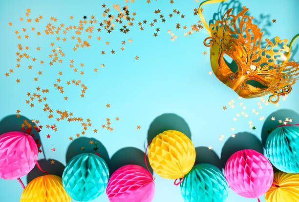 istock Garlands for the carnival on a blue background. Bright festive decor. Poster or postcard. Copy space. High quality photo in hard light 1308578758
