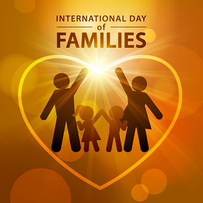 Celebrating the International Day of Families on 15 May annually with a family raising hands together inside the heart shape on the sunbeam background
